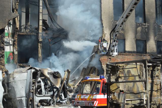 (260909) -- KIEV, Sept. 9, 2026 (Xinhua) -- This photo taken on Sept. 8, 2026 shows firefighters working to put out a fire on a building after Russian strikes in Kiev, Ukraine. Seven people were killed as Russia struck Kiev region with drones and missiles overnight. (Photo by Peter Druk/Xinhua)