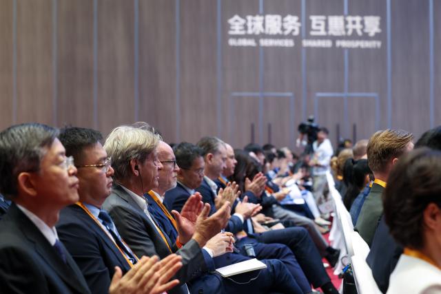 (260909) -- BEIJING, Sept. 9, 2026 (Xinhua) -- People attend the Global Trade in Services Summit of the 2026 China International Fair for Trade in Services (CIFTIS) in Beijing, capital of China, Sept. 9, 2026. The summit opened here on Wednesday. (Xinhua/Chen Yichen)