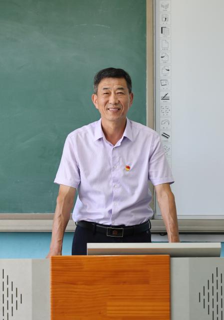(260909) -- TIANJIN, Sept. 9, 2026 (Xinhua) -- This photo taken on Sept. 3, 2026 shows a portrait of Zheng Baoguo in Luozhuangzi Town of Jizhou District in Tianjin, north China.
  The Sangyuan campus of Hongshuizhuang Central Primary School is located at the foot of the Yanshan Mountains in Jizhou District. The small rural school has just 28 students and serves three neighboring villages. It allows local children to attend classes close to home rather than travel nearly 10 kilometers to the town's central primary school.
  Zheng Baoguo, 56 and a native of Jizhou District, has worked at the school for more than 20 years. After graduating from a secondary normal school in 1989, he became a rural teacher. He has long believed that education is a key to a brighter future for children in mountainous areas.
  In 2003, Zheng became the first principal of the Sangyuan campus. Although he later had an opportunity to work in an urban school, he chose to stay and continue his career in his hometown. More than two decades later, Zheng still teaches classes himself despite serving as principal, and he always creates a relaxed and cheerful atmosphere for his students.
  "A teacher can change a child's life. As a teacher, I must live up to families' trust," Zheng said, "As long as the school remains open, I will keep doing my best to ensure that children in these mountain villages have access to education close to home." (Xinhua/Li Ran)