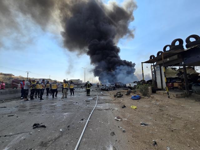 (260909) -- SYRIA, Sept. 9, 2026 (Xinhua) -- Smoke billows from the site of an explosion at an ammunition storage site near the city of Sarmada in Syria's northwestern Idlib province, Sept. 9, 2026. At least three people were killed and more than 10 others injured on Wednesday in the explosion, according to preliminary reports. (Str/Xinhua)