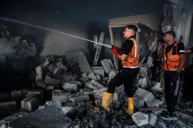 (260909) -- GAZA, Sept. 9, 2026 (Xinhua) -- A Palestinian extinguishes fire in a destroyed residential apartment following an Israeli airstrike in Gaza City, Sept. 8, 2026. (Photo by Rizek Abdeljawad/Xinhua)