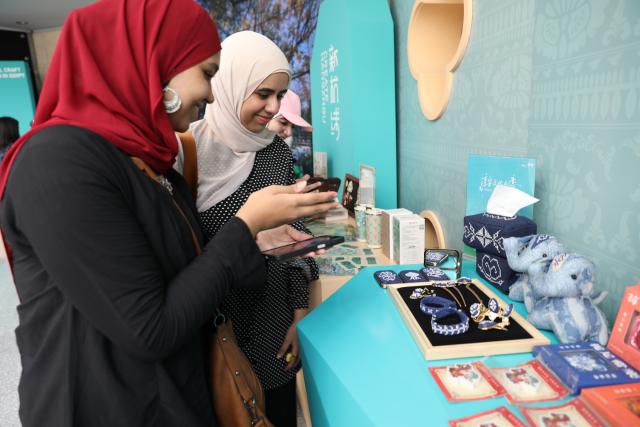 (260909) -- CAIRO, Sept. 9, 2026 (Xinhua) -- Egyptian visitors view exhibits during the Hangzhou Traditional Craft Innovation Exhibition at the National Museum of Egyptian Civilization in Cairo, Egypt, Sept. 9, 2026. TO GO WITH "Hangzhou crafts exhibition in Egypt showcases traditional Chinese heritage" (Xinhua/Zhang Jian)