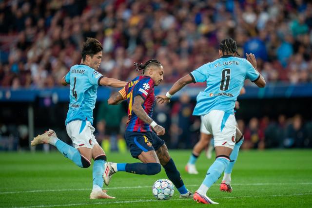 (260910) -- BARCELONA, Sept. 10, 2026 (Xinhua) -- FC Barcelona's Raphinha (C) vies with Feyenoord's Watanabe Tsuyoshi (L) and Jerry St. Juste during the UEFA Champions League match between FC Barcelona and Feyenoord in Barcelona, Spain, on Sept. 9, 2026. (Photo by Joan Gosa/Xinhua)