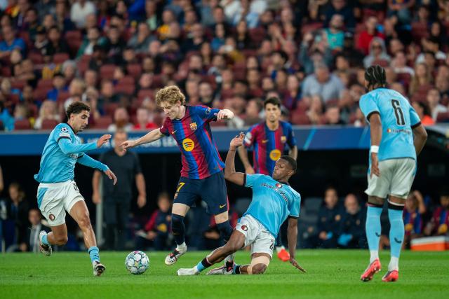 (260910) -- BARCELONA, Sept. 10, 2026 (Xinhua) -- FC Barcelona's Anthony Gordon (2nd L) vies with Feyenoord's Givairo Read (2nd R) during the UEFA Champions League match between FC Barcelona and Feyenoord in Barcelona, Spain, on Sept. 9, 2026. (Photo by Joan Gosa/Xinhua)