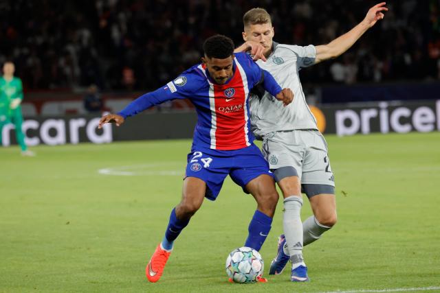 (260910) -- PARIS, Sept. 10, 2026 (Xinhua) -- PSG's Senny Mayulu vies with Slovan Bratislava's Alen Mustafic compete during the Champion's League first round soccer game between Paris Saint-Germain (PSG) and Slovan Bratislava in Parc des Princes Stadium, Paris, France, Sept. 9, 2026. (Photo by Henri Szwarc/Xinhua)