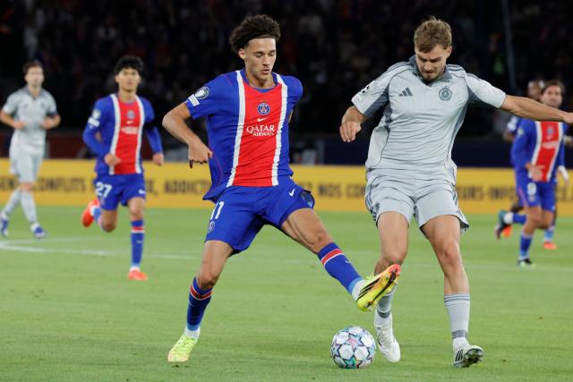 (260910) -- PARIS, Sept. 10, 2026 (Xinhua) -- PSG's Maghnes Akliouche vies with Slovan Bratislava's Peter Pokorny during the Champion's League first round soccer game between Paris Saint-Germain (PSG) and Slovan Bratislava in Parc des Princes Stadium, Paris, France, Sept. 9, 2026. (Photo by Henri Szwarc/Xinhua)