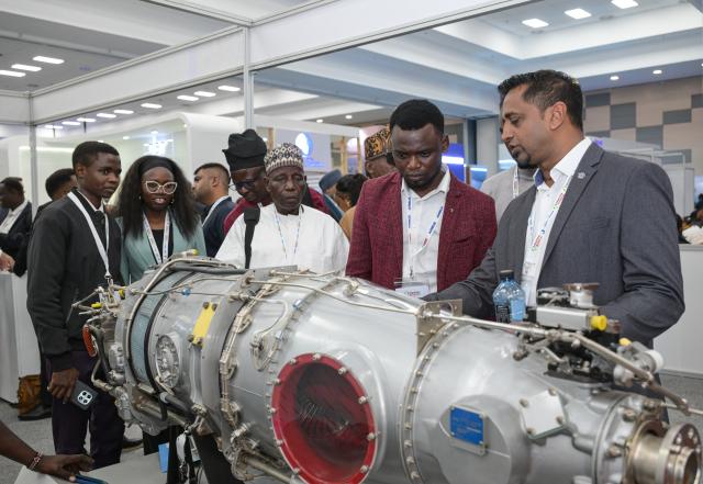 (260910) -- NAIROBI, Sept. 10, 2026 (Xinhua) -- Visitors view an aircraft engine at the 10th Aviation Africa Summit and Exhibition in Nairobi, Kenya, Sept. 9, 2026. The 10th Aviation Africa Summit and Exhibition, held Wednesday and Thursday in Nairobi, the Kenyan capital, brought together about 2,500 delegates from more than 100 countries, including representatives from 135 airlines and aviation operators. (Xinhua/Yang Guang)