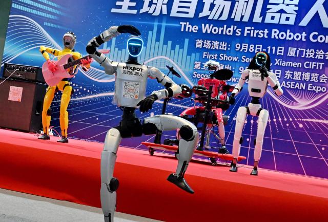 (260910) -- XIAMEN, Sept. 10, 2026 (Xinhua) -- Embodied robots from HIXBOT perform at the 26th China International Fair for Investment and Trade in Xiamen, southeast China's Fujian Province, Sept. 9, 2026. The 26th China International Fair for Investment and Trade opened Tuesday in Xiamen, drawing registrations from more than 1,200 government institutions and business delegations from 129 countries and regions, as well as 30 international organizations. Technological achievements in cutting-edge fields including artificial intelligence, low-altitude economy, new energy storage, and green power are showcased in this event. (Xinhua/Lin Shanchuan)