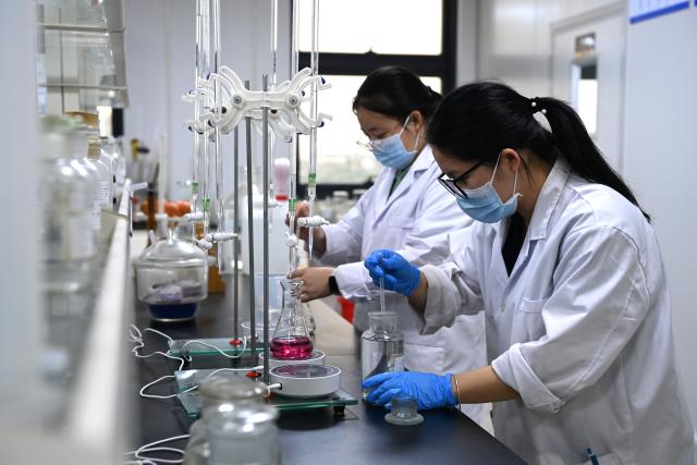 (260910) -- NANNING, Sept. 10, 2026 (Xinhua) -- Staff members check product quality at an export-oriented food additive manufacturing enterprise at the China-Malaysia Qinzhou Industrial Park in Qinzhou City, south China's Guangxi Zhuang Autonomous Region, Sept. 4, 2026. Pinglu Canal in south China's Guangxi Zhuang Autonomous Region will become operational on Sept. 16. The 134.2-km canal links the Xijiang River shipping route in the north with the Beibu Gulf in the south. It is China's first major river-to-sea canal project that has been planned and coordinated at the national level since 1949.
   Centering the Pinglu Canal Economic Belt as its main artery, Guangxi focuses on large-capacity, port and waterway-related industries. It builds port-adjacent parks along the canal tailored to local conditions, forming industrial clusters that support upstream and downstream industries and foster collaboration among large, medium, and small enterprises.
   Across Guangxi, localities leverage their own resources to position themselves within a maritime-oriented industrial layout, advancing the high-quality development of the marine economy. (Xinhua/Cao Yiming)