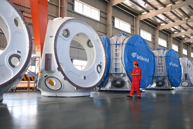 (260910) -- NANNING, Sept. 10, 2026 (Xinhua) -- A staff member registers products at a wind power equipment manufacturing enterprise in Qinzhou City, south China's Guangxi Zhuang Autonomous Region, Sept. 3, 2026. Pinglu Canal in south China's Guangxi Zhuang Autonomous Region will become operational on Sept. 16. The 134.2-km canal links the Xijiang River shipping route in the north with the Beibu Gulf in the south. It is China's first major river-to-sea canal project that has been planned and coordinated at the national level since 1949.
   Centering the Pinglu Canal Economic Belt as its main artery, Guangxi focuses on large-capacity, port and waterway-related industries. It builds port-adjacent parks along the canal tailored to local conditions, forming industrial clusters that support upstream and downstream industries and foster collaboration among large, medium, and small enterprises.
   Across Guangxi, localities leverage their own resources to position themselves within a maritime-oriented industrial layout, advancing the high-quality development of the marine economy. (Xinhua/Cao Yiming)
