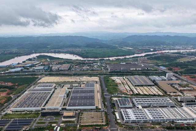(260910) -- NANNING, Sept. 10, 2026 (Xinhua) -- An aerial drone photo taken on Sept. 5, 2026 shows a view of the Qingxiu industrial park in Nanning City, south China's Guangxi Zhuang Autonomous Region. Pinglu Canal in south China's Guangxi Zhuang Autonomous Region will become operational on Sept. 16. The 134.2-km canal links the Xijiang River shipping route in the north with the Beibu Gulf in the south. It is China's first major river-to-sea canal project that has been planned and coordinated at the national level since 1949.
   Centering the Pinglu Canal Economic Belt as its main artery, Guangxi focuses on large-capacity, port and waterway-related industries. It builds port-adjacent parks along the canal tailored to local conditions, forming industrial clusters that support upstream and downstream industries and foster collaboration among large, medium, and small enterprises.
   Across Guangxi, localities leverage their own resources to position themselves within a maritime-oriented industrial layout, advancing the high-quality development of the marine economy. (Xinhua/Lu Boan)