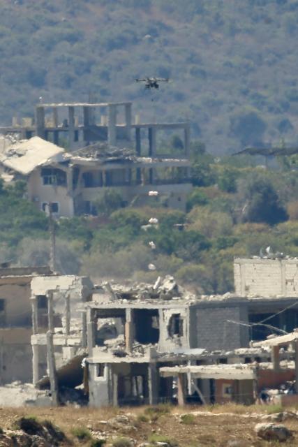 (260910) -- MANSOURI, Sept. 10, 2026 (Xinhua) -- This photo taken on Sept. 9, 2026 shows an Israeli drone dropping explosives over houses in the town of Mansouri, southern Lebanon. (Photo by Ali Hashisho/Xinhua)