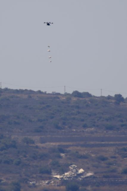 (260910) -- MANSOURI, Sept. 10, 2026 (Xinhua) -- This photo taken on Sept. 9, 2026 shows an Israeli drone dropping explosives in the town of Mansouri, southern Lebanon. (Photo by Ali Hashisho/Xinhua)