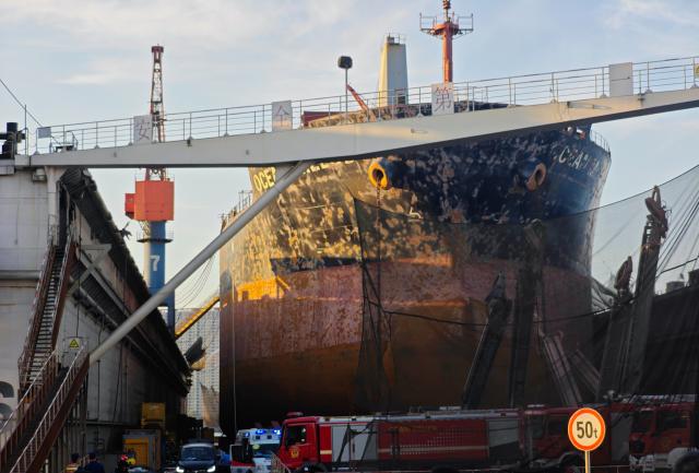 (260910) -- QINGDAO, Sept. 10, 2026 (Xinhua) -- This photo taken on Sept. 10, 2026 shows the site of a cargo ship fire in Qingdao, east China's Shandong Province. Twenty people were confirmed dead and five others remained missing after a foreign cargo ship caught fire during maintenance at a shipyard here on Thursday, local authorities said. (Xinhua/Li Aoqiu)