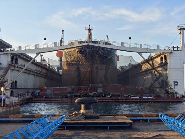 (260910) -- QINGDAO, Sept. 10, 2026 (Xinhua) -- This photo taken on Sept. 10, 2026 shows the site of a cargo ship fire in Qingdao, east China's Shandong Province. Twenty people were confirmed dead and five others remained missing after a foreign cargo ship caught fire during maintenance at a shipyard here on Thursday, local authorities said. (Xinhua/Li Aoqiu)