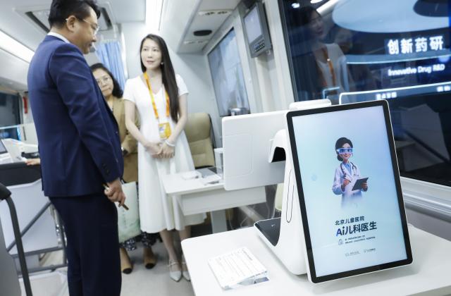 (260910) -- BEIJING, Sept. 10, 2026 (Xinhua) -- Visitors learn about an AI-powered pediatrician module equipped on a medical service vehicle during the 2026 China International Fair for Trade in Services (CIFTIS) at Shougang Park in Beijing, capital of China, Sept. 9, 2026. Themed exhibition halls are showcasing new technologies, emerging business models and innovative applications at the ongoing 2026 CIFTIS, giving visitors a firsthand look at cutting-edge innovations in trade and services. (Xinhua/Zhang Yuwei)