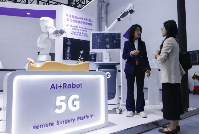 (260910) -- BEIJING, Sept. 10, 2026 (Xinhua) -- A visitor learns about an AI-powered remote robotic surgery platform during the 2026 China International Fair for Trade in Services (CIFTIS) at Shougang Park in Beijing, capital of China, Sept. 9, 2026. Themed exhibition halls are showcasing new technologies, emerging business models and innovative applications at the ongoing 2026 CIFTIS, giving visitors a firsthand look at cutting-edge innovations in trade and services. (Xinhua/Zhang Yuwei)