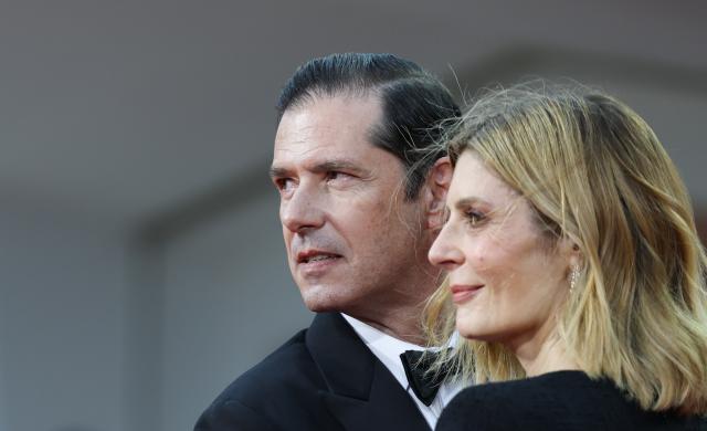 (260910) -- VENICE, Sept. 10, 2026 (Xinhua) -- French actor Melvil Poupaud (L) and French actress Chiara Mastroianni of the film "One Minute To Midnight" pose at the red carpet before the premiere of the film during the 83rd Venice International Film Festival in Venice, Italy, Sept. 10, 2026. (Xinhua/Wang Kaiyan)