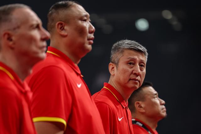 (260911) -- NAGOYA, Sept. 11, 2026 (Xinhua) -- Guo Shiqiang (2nd R), head coach of China, reacts ahead of the men's basketball group C match between China and Kazakhstan at the 20th Asian Games in Nagoya, Japan, Sept. 11, 2026. (Xinhua/Jia Haocheng)