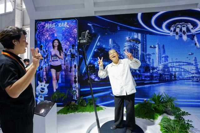 (260912) -- BEIJING, Sept. 12, 2026 (Xinhua) -- A visitor tries panoramic photography at the themed exhibition area for culture and tourism services during the 2026 China International Fair for Trade in Services (CIFTIS) at Shougang Park in Beijing, capital of China, Sept. 12, 2026. The 2026 CIFTIS, running from Sept. 9 to 13 at Shougang Park in Beijing, has brought together 413 exhibitors at the themed exhibition area for culture and tourism services, showcasing emerging models of cultural and tourism integration. (Xinhua/Ju Huanzong)