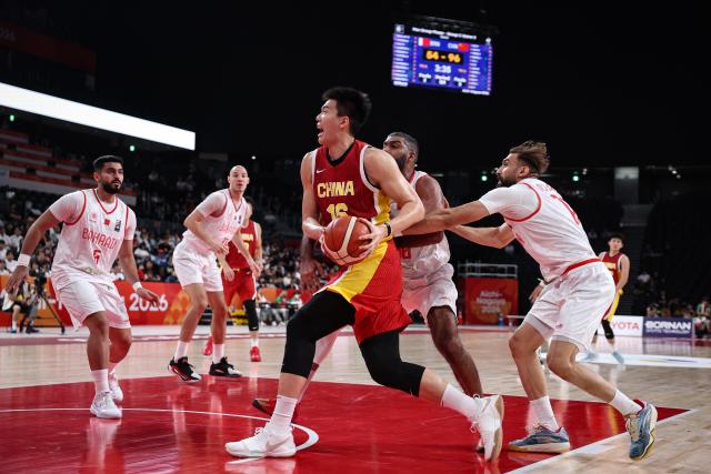(260912) -- NAGOYA, Sept. 12, 2026 (Xinhua) -- Jiao Boqiao (C) of China competes during the group C match between China and Bahrain at 20th Asian Games Aichi-Nagoya 2026 in Nagoya, Japan, Sept. 12, 2026. (Xinhua/Jia Haocheng)