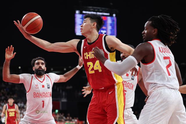(260912) -- NAGOYA, Sept. 12, 2026 (Xinhua) -- Cui Yongxi (2nd L) of China competes during the group C match between China and Bahrain at 20th Asian Games Aichi-Nagoya 2026 in Nagoya, Japan, Sept. 12, 2026. (Xinhua/Jia Haocheng)