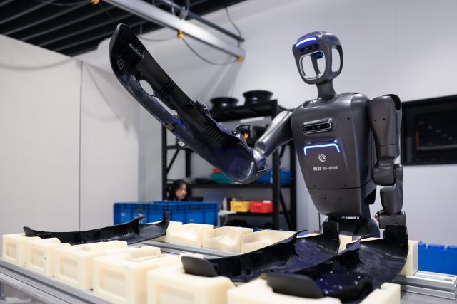(260912) -- CHANGCHUN, Sept. 12, 2026 (Xinhua) -- A robot undergoes a test in automotive production scenario at a laboratory in a bionic robot innovation center in Changchun, northeast China's Jilin Province, Sept. 7, 2026.
  Currently, the bionic embodied intelligent robot team at Jilin University is conducting frontier research on bionic robots. Bringing together researchers from bionics, mechanics, materials, artificial intelligence, computer science, and information engineering, the team has carried out extensive biomechanical testing and modeling analysis, and pioneered the theory and technology of bionic tension-compression body robots internationally. It has developed bionic tension-compression dexterous hands, robotic arms, and complete robot systems.
   "Drawing wisdom from the human body, we are using bionic tension-compression body technology to rebuild the industrial backbone of China's robotics industry, in hopes of truly equipping our robots with human-like dexterity and intelligence," said Ren Lei, academic leader of bionic robotics at Jilin University. (Xinhua/Xu Chang)