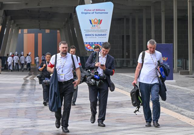 (260912) -- NEW DELHI, Sept. 12, 2026 (Xinhua) -- Media staff arrive at Bharat Mandapam, the main venue of the 18th BRICS Summit in New Delhi, India, Sept. 12, 2026. (Xinhua/Javed Dar)