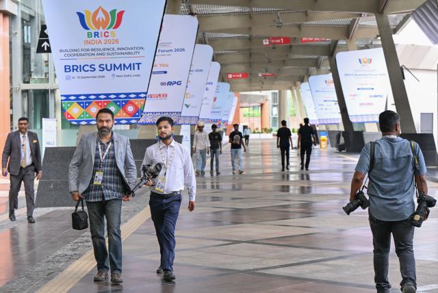 (260912) -- NEW DELHI, Sept. 12, 2026 (Xinhua) -- Media staff arrive at Bharat Mandapam, the main venue of the 18th BRICS Summit in New Delhi, India, Sept. 12, 2026. (Xinhua/Javed Dar)