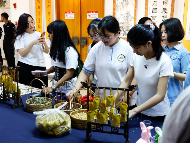 (260912) -- YANGON, Sept. 12, 2026 (Xinhua) -- People attend an event to celebrate the upcoming Mid-Autumn Festival at the China Cultural Center in Yangon, Myanmar, Sept. 12, 2026. TO GO WITH "Feature: Myanmar embraces Chinese traditions at ceremony marking Mid-Autumn Festival" (Xinhua/Myo Kyaw Soe)