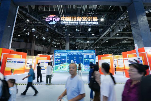 (260912) -- BEIJING, Sept. 12, 2026 (Xinhua) -- Visitors browse the China Service Case Showcase at the 2026 China International Fair for Trade in Services (CIFTIS) at Shougang Park in Beijing, capital of China, Sept. 12, 2026. The 2026 CIFTIS is open to the general public from Sept. 12 to 13. Visitors with reservation can access the fair free of charge. (Xinhua/Ju Huanzong)