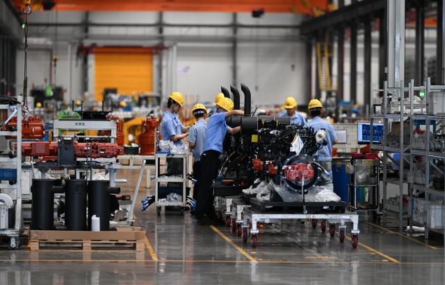 (260912) -- NANNING, Sept. 12, 2026 (Xinhua) -- Staff members work on a production line at Liugong Excavators Intelligent Factory in Liuzhou, south China's Guangxi Zhuang Autonomous Region, Sept. 2, 2026. Some products of the factory are sold to overseas markets.
  Pinglu Canal in south China's Guangxi Zhuang Autonomous Region will become operational on Sept. 16, according to a Monday press conference on the canal's opening.
  The 134.2-km canal links the Xijiang River shipping route in the north with the Beibu Gulf in the south. It is China's first major river-to-sea canal project that has been planned and coordinated at the national level since 1949.
  Designed to accommodate vessels of up to 5,000 tonnes, the canal stretches along the country's New International Land-Sea Trade Corridor, a strategic route linking China's inland regions with ASEAN and other global markets.
  It is expected to shorten the shipping distance between China's southwestern hinterland and ASEAN by 560 km and reduce logistics costs by 18 to 30 percent, said Lu Xinning, vice chairperson of the regional government, in another press conference held in early September. (Photo by Zheng Changhao/Xinhua)
