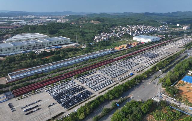 (260912) -- NANNING, Sept. 12, 2026 (Xinhua) -- An aerial drone photo shows cars waiting to be exported via freight trains at an automobile logistics base in Liuzhou, south China's Guangxi Zhuang Autonomous Region, April 9, 2026.
  Pinglu Canal in south China's Guangxi Zhuang Autonomous Region will become operational on Sept. 16, according to a Monday press conference on the canal's opening.
  The 134.2-km canal links the Xijiang River shipping route in the north with the Beibu Gulf in the south. It is China's first major river-to-sea canal project that has been planned and coordinated at the national level since 1949.
  Designed to accommodate vessels of up to 5,000 tonnes, the canal stretches along the country's New International Land-Sea Trade Corridor, a strategic route linking China's inland regions with ASEAN and other global markets.
  It is expected to shorten the shipping distance between China's southwestern hinterland and ASEAN by 560 km and reduce logistics costs by 18 to 30 percent, said Lu Xinning, vice chairperson of the regional government, in another press conference held in early September. (Photo by Zheng Changhao/Xinhua)