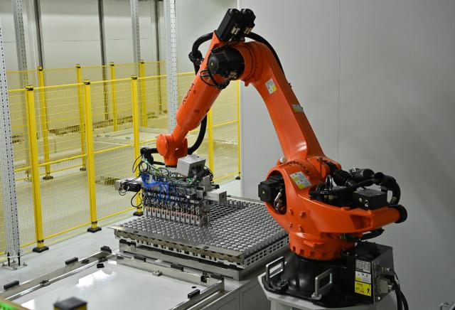 (260912) -- NANNING, Sept. 12, 2026 (Xinhua) -- A robotic arm produces new energy vehicle batteries in an industrial park in Nanning, south China's Guangxi Zhuang Autonomous Region, Sept. 5, 2026.
  Pinglu Canal in south China's Guangxi Zhuang Autonomous Region will become operational on Sept. 16, according to a Monday press conference on the canal's opening.
  The 134.2-km canal links the Xijiang River shipping route in the north with the Beibu Gulf in the south. It is China's first major river-to-sea canal project that has been planned and coordinated at the national level since 1949.
  Designed to accommodate vessels of up to 5,000 tonnes, the canal stretches along the country's New International Land-Sea Trade Corridor, a strategic route linking China's inland regions with ASEAN and other global markets.
  It is expected to shorten the shipping distance between China's southwestern hinterland and ASEAN by 560 km and reduce logistics costs by 18 to 30 percent, said Lu Xinning, vice chairperson of the regional government, in another press conference held in early September. (Xinhua/Lu Boan)