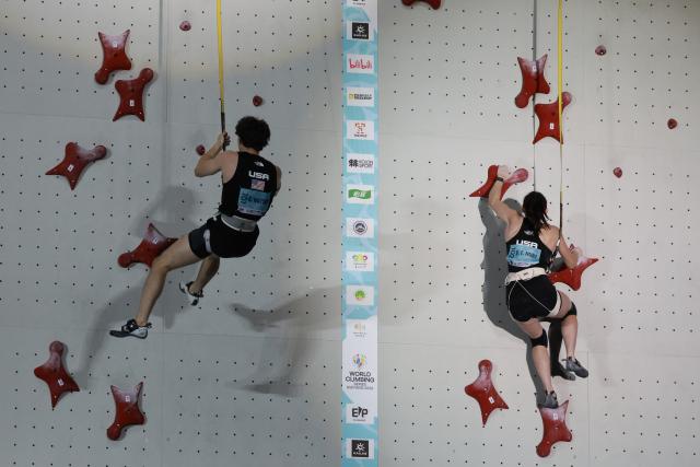 (260912) -- GUIYANG, Sept. 12, 2026 (Xinhua) -- Samuel Watson (L) and Emma Hunt of the United States compete during the mixed speed relay at the World Climbing Series Guiyang 2026 in Guiyang, southwest China's Guizhou Province, Sept. 12, 2026. (Xinhua/Liu Xu)