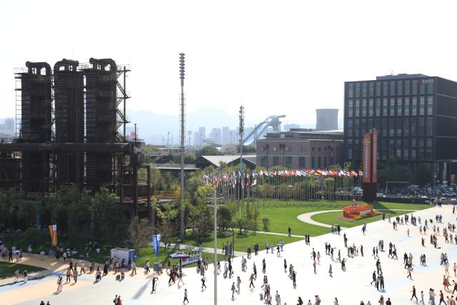 (260912) -- BEIJING, Sept. 12, 2026 (Xinhua) -- People visit the 2026 China International Fair for Trade in Services at Shougang Park in Beijing, capital of China, Sept. 12, 2026.
  Beijing's Shougang Park saw its last blast furnace shut down in 2010, marking the end of more than a century of steelmaking. After more than a decade of transformation, the former industrial site now blends preserved steel structures with modern architecture and green spaces.
  The park hosted the Big Air Shougang, a landmark venue of the Beijing 2022 Winter Olympics, and has since evolved into a hub for exhibitions, commerce, sports and cultural tourism. It is now the permanent venue of the China International Fair for Trade in Services and has also attracted businesses in emerging fields such as science fiction and technology.
  From an old industrial site to a vibrant urban destination, Shougang Park offers a vivid example of how China is transforming its traditional industrial bases. (Photo by Liang Jiayuan/Xinhua)