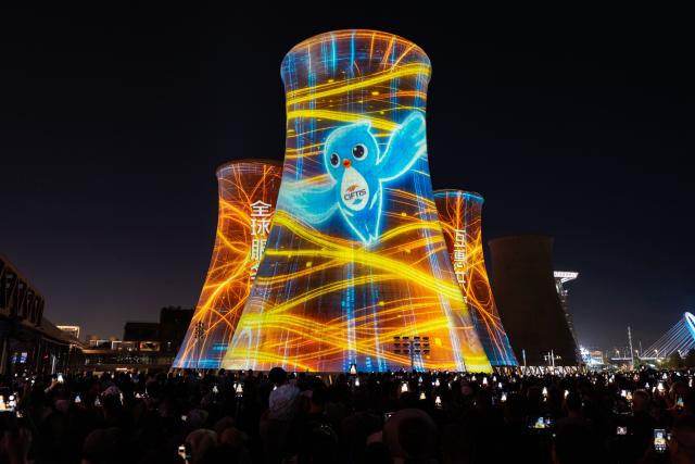 (260912) -- BEIJING, Sept. 12, 2026 (Xinhua) -- People watch a light show at Shougang Park in Beijing, capital of China, Sept. 10, 2026.
  Beijing's Shougang Park saw its last blast furnace shut down in 2010, marking the end of more than a century of steelmaking. After more than a decade of transformation, the former industrial site now blends preserved steel structures with modern architecture and green spaces.
  The park hosted the Big Air Shougang, a landmark venue of the Beijing 2022 Winter Olympics, and has since evolved into a hub for exhibitions, commerce, sports and cultural tourism. It is now the permanent venue of the China International Fair for Trade in Services and has also attracted businesses in emerging fields such as science fiction and technology.
  From an old industrial site to a vibrant urban destination, Shougang Park offers a vivid example of how China is transforming its traditional industrial bases. (Xinhua/Zhang Xiaoyu)