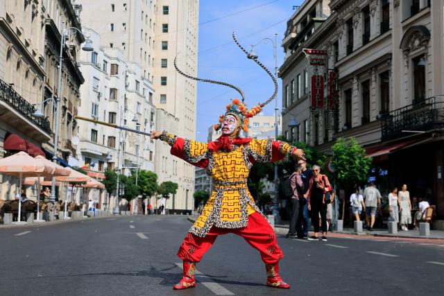 (260912) -- BUCHAREST, Sept. 12, 2026 (Xinhua) -- An artist performs at the Open Streets event under the theme of "Discover Guangxi" to promote the culture and traditions of south China's Guangxi Zhuang Autonomous Region, in Bucharest, Romania, Sept. 12, 2026. (Photo by Cristian Cristel/Xinhua)