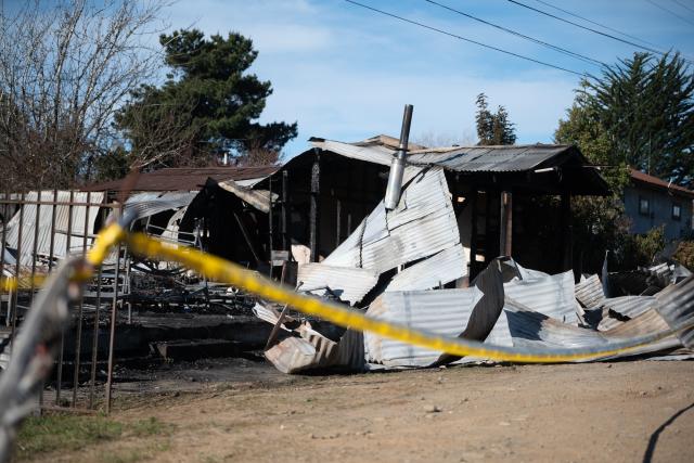 (260912) -- ARAUCANIA, Sept. 12, 2026 (Xinhua) -- This photo shows the scene of a fire in Pitrufquen, in the Araucania Region of southern Chile, on Sept. 12, 2026. At least 16 people were killed after a fire broke out on Friday evening at a nursing home in southern Chile, local media reported on Saturday. (Xinhua)