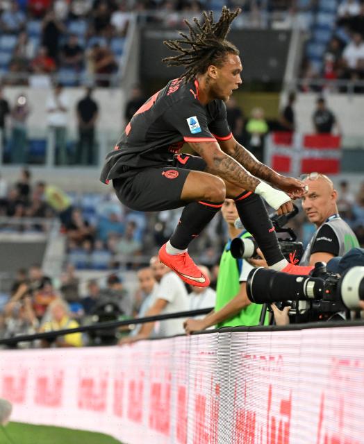 (260913) -- ROME, Sept. 13, 2026 (Xinhua) -- AC Milan's Diego Moreira celebrates his goal during a Serie A football match between Lazio and AC Milan in Rome, Italy, Sept. 12, 2026. (Photo by Alberto Lingria/Xinhua)
