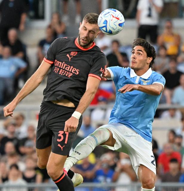 (260913) -- ROME, Sept. 13, 2026 (Xinhua) -- Lazio's Matteo Cancellieri (R) vies with AC Milan's Strahinja Pavlovic during a Serie A football match between Lazio and AC Milan in Rome, Italy, Sept. 12, 2026. (Photo by Alberto Lingria/Xinhua)