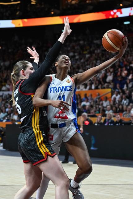 (260913) -- BERLIN, Sept. 13, 2026 (Xinhua) -- Valeriane Ayayi (R) of France goes for a layup during the semifinal match between France and Germany at the FIBA Women's Basketball World Cup 2026 in Berlin, Germany, Sept. 12, 2026. (Xinhua/Zhang Haofu)