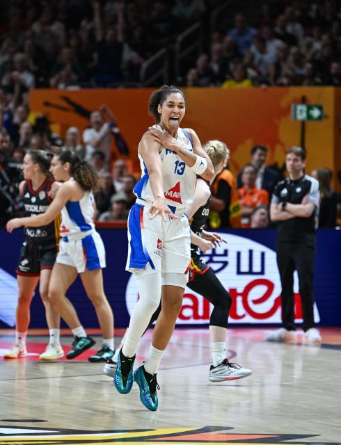 (260913) -- BERLIN, Sept. 13, 2026 (Xinhua) -- Janelle Salaun of France celebrates a three pionter during the semifinal match between France and Germany at the FIBA Women's Basketball World Cup 2026 in Berlin, Germany, Sept. 12, 2026. (Xinhua/Zhang Haofu)