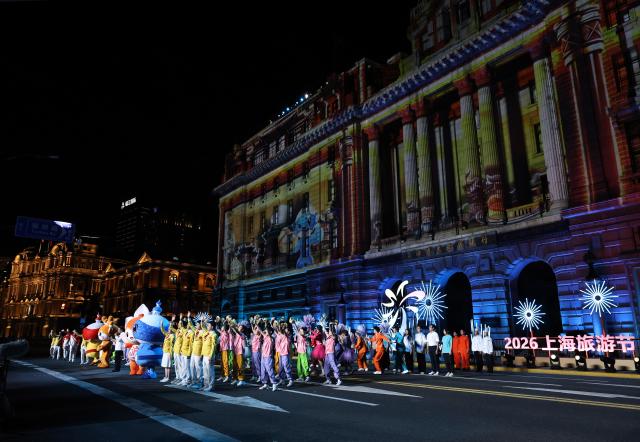 (260913) -- SHANGHAI, Sept. 13, 2026 (Xinhua) -- A troupe themed on the 48th WorldSkills Competition attends the parade of the Shanghai Tourism Festival in Shanghai, east China, Sept. 12, 2026. The 37th Shanghai Tourism Festival parade was launched at the Bund in Shanghai on Saturday. A total of 21 floats and 21 performing teams took part in the parade. (Xinhua/Fang Zhe)