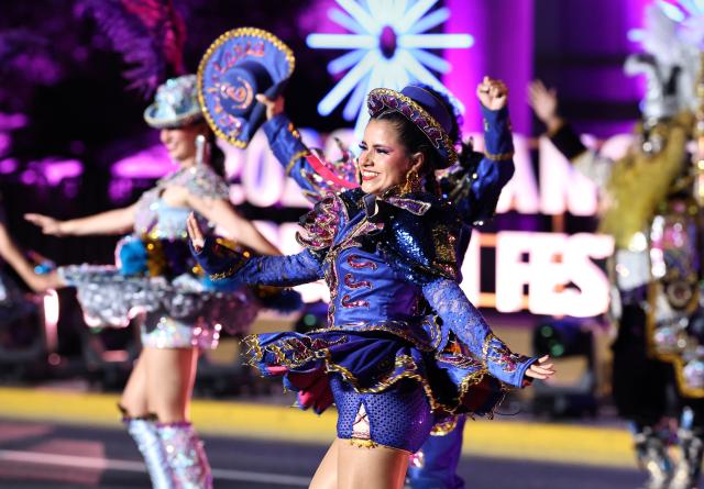 (260913) -- SHANGHAI, Sept. 13, 2026 (Xinhua) -- An art troupe from Peru performs during the parade of the Shanghai Tourism Festival in Shanghai, east China, Sept. 12, 2026. The 37th Shanghai Tourism Festival parade was launched at the Bund in Shanghai on Saturday. A total of 21 floats and 21 performing teams took part in the parade. (Xinhua/Fang Zhe)
