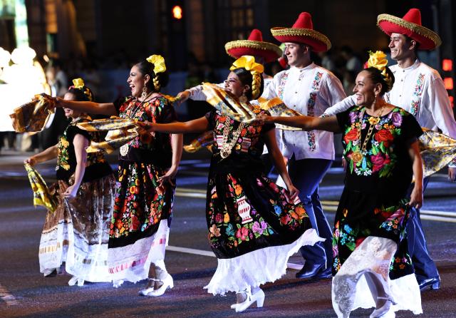 (260913) -- SHANGHAI, Sept. 13, 2026 (Xinhua) -- A folk dance troupe from Mexico performs during the parade of the Shanghai Tourism Festival in Shanghai, east China, Sept. 12, 2026. The 37th Shanghai Tourism Festival parade was launched at the Bund in Shanghai on Saturday. A total of 21 floats and 21 performing teams took part in the parade. (Xinhua/Fang Zhe)