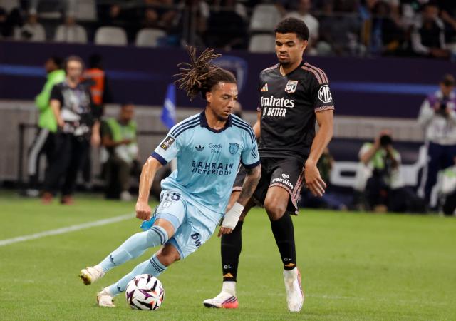 (260913) -- PARIS, Sept. 13, 2026 (Xinhua) -- Luca Koleosho (L) of Paris FC vies with Zachary Athekame of Lyon during the Ligue 1 football match between Paris FC and Lyon in Paris, France, Sept. 12, 2026. (Photo by Henri Szwarc/Xinhua)