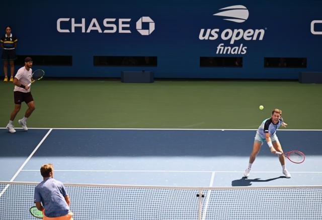 (260913) -- NEW YORK, Sept. 13, 2026 (Xinhua) -- Christian Harrison (L)/Neal Skupski compete during the men's doubles final match between Christian Harrison (the United States)/Neal Skupski (Britain) and Kevin Krawietz/Tim Puetz of Germany at the 2026 US Open tennis championships in New York, the United States, Sept. 12, 2026. (Xinhua/Li Rui)