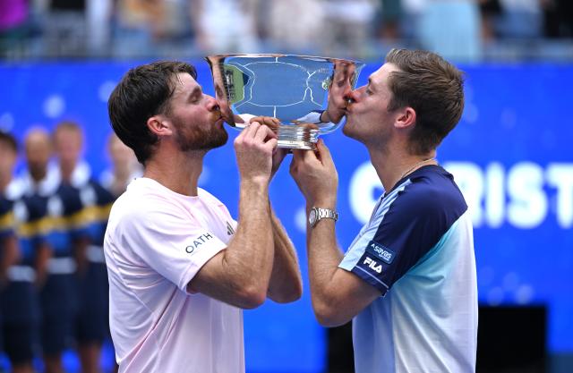 (260913) -- NEW YORK, Sept. 13, 2026 (Xinhua) -- Christian Harrison (L)/Neal Skupski kiss the trophy during the awarding ceremony after the men's doubles final match between Christian Harrison (the United States)/Neal Skupski (Britain) and Kevin Krawietz/Tim Puetz of Germany at the 2026 US Open tennis championships in New York, the United States, Sept. 12, 2026. (Xinhua/Li Rui)