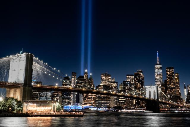 (260913) -- BEIJING, Sept. 13, 2026 (Xinhua) -- This photo taken on Sept. 11, 2026 shows blue beams of light symbolizing the twin towers of the World Trade Center that collapsed in the 9/11 attacks, in New York, the United States. New Yorkers on Friday commemorated the victims of the 9/11 attacks on the 25th anniversary of the tragedy.
   As the sun set, two massive blue beams of light illuminated the sky, symbolizing the twin towers of the World Trade Center that collapsed in the attacks. Other iconic landmarks across the city, including the Empire State Building, also illuminated their facades in blue. (Photo by Zack Zhang/Xinhua)